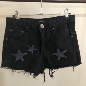 Black jean shorts with star embroidery